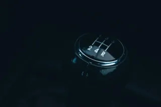 The gear selector inside a car