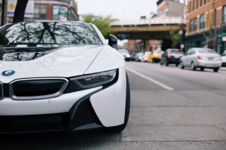 A car parked beside an urban street
