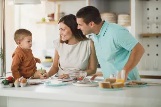 Parents and a child preparing breakfast