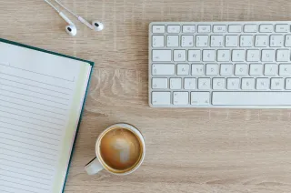 Study materials beside a computer keyboard