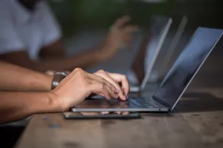 A person working at a laptop