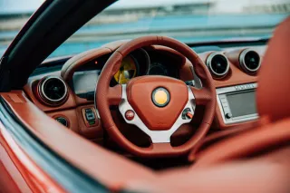 The steering wheel and interior of a car