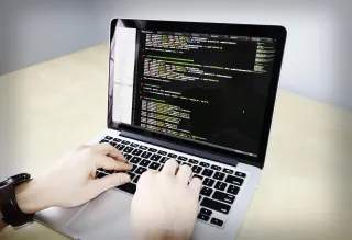 A developer working on a laptop