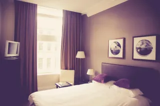 A bed in a furnished bedroom